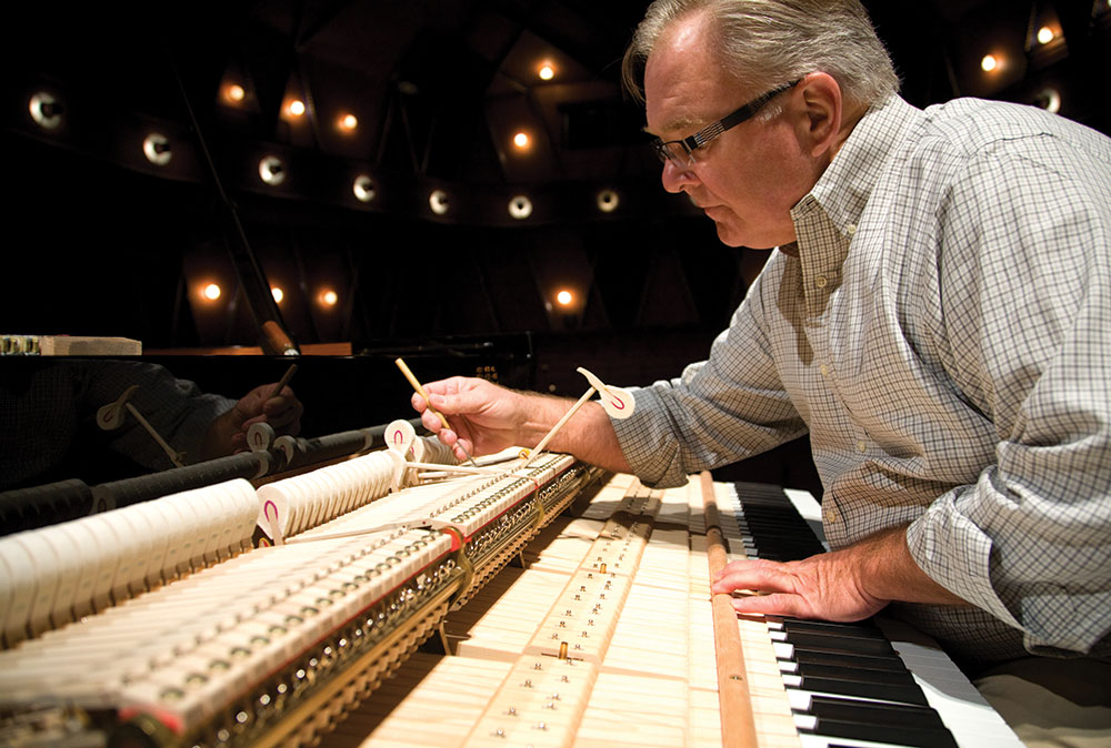 Striking a chord . . . piano technician James Williams